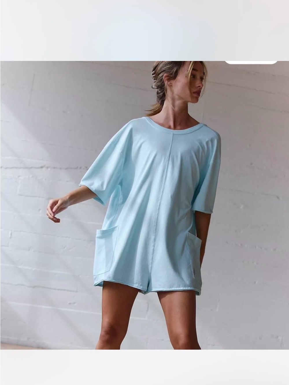 Free People Hot Shot Reversible Tee Romper in light blue.